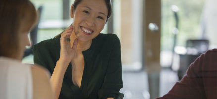 a woman sitting on a table