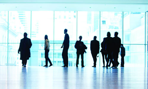 a group of people standing on the floor